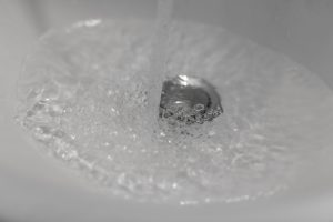 Water running down sink drain